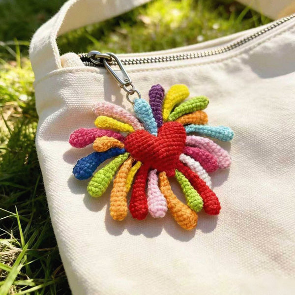 Crochet firework flower keychain on white canvas bag