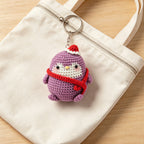 Crochet Christmas penguin with metal keyring, front view | Knoblom