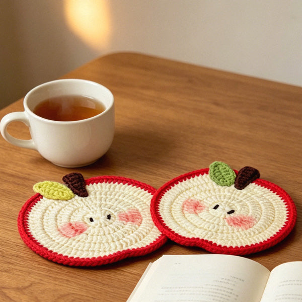 Crochet apple coaster in blue border variant, top view | Knoblom