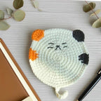 Crochet cat coaster in black variant, top view | Knoblom