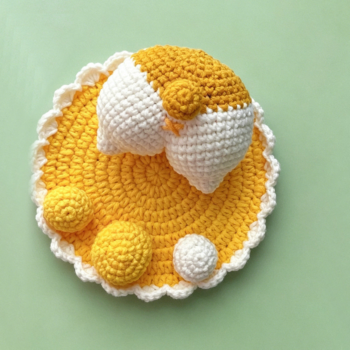 Crochet duck stand holding smartphone, functional view | Knoblom