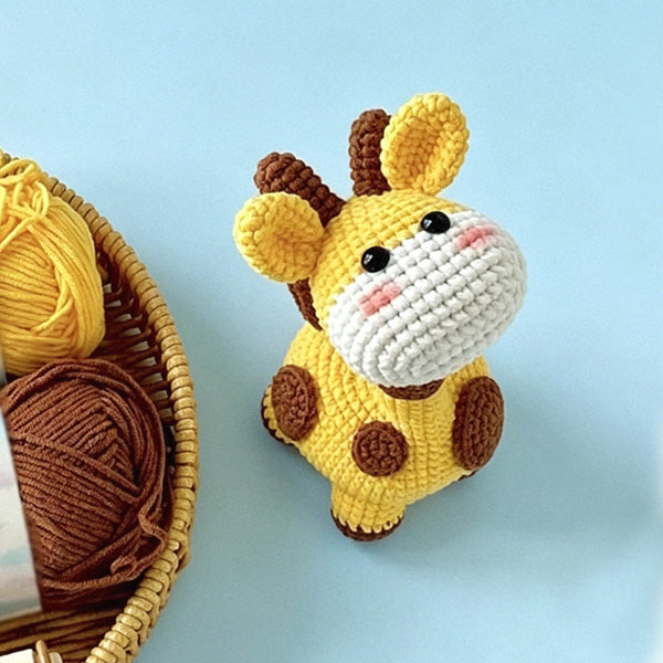 Crochet giraffe doll, side view showing yarn texture | Knoblom