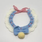 Crochet lace ruffle pet collar in purple and pink with yellow pom-pom, close-up | Knoblom

