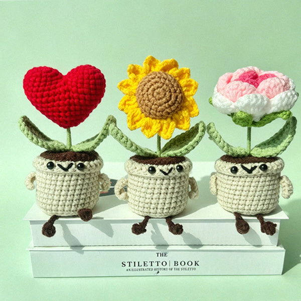 Crochet tulip pot amigurumi in pink, styled on shelf | Knoblom