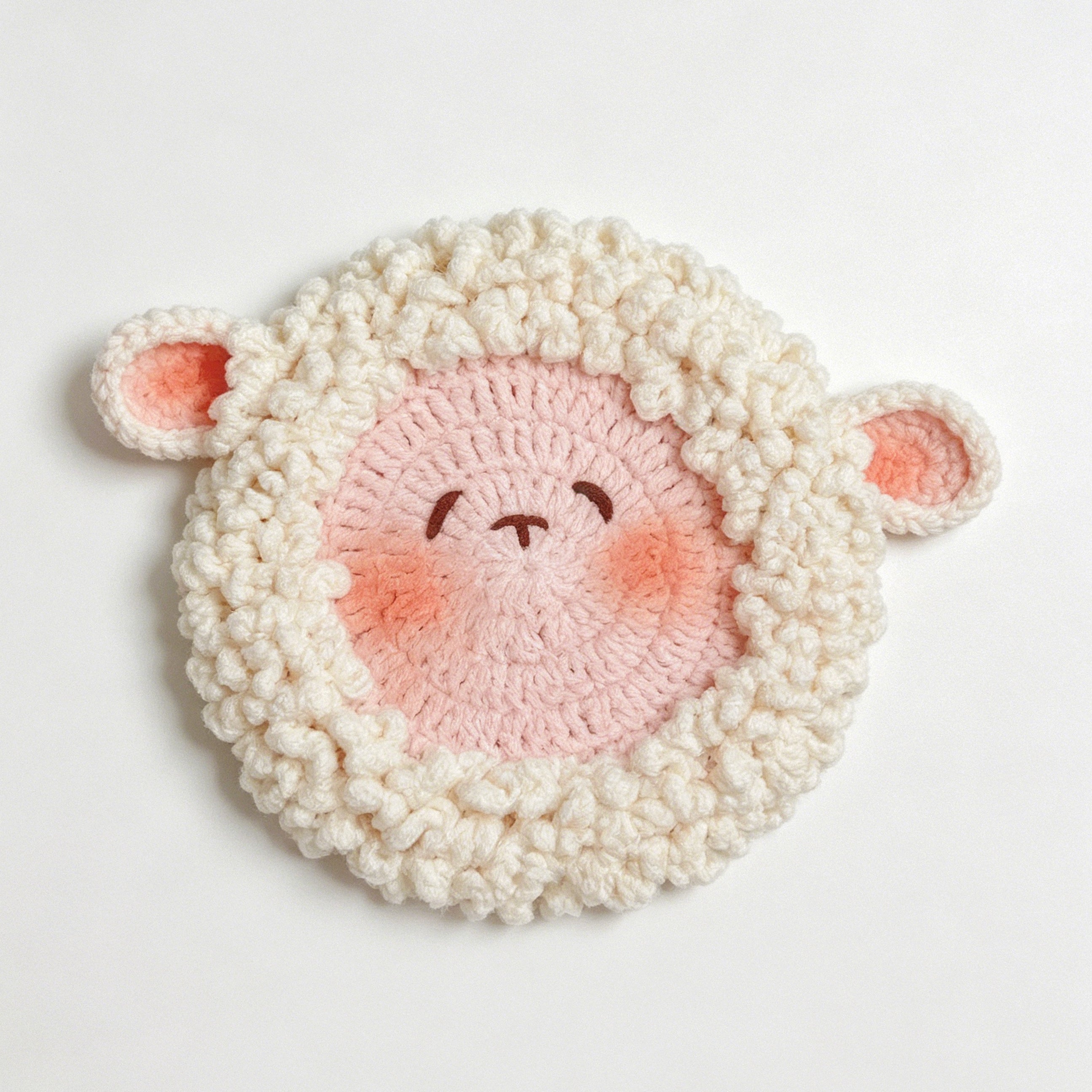 Handcrafted lamb coaster in chenille yarn, close-up texture | Knoblom