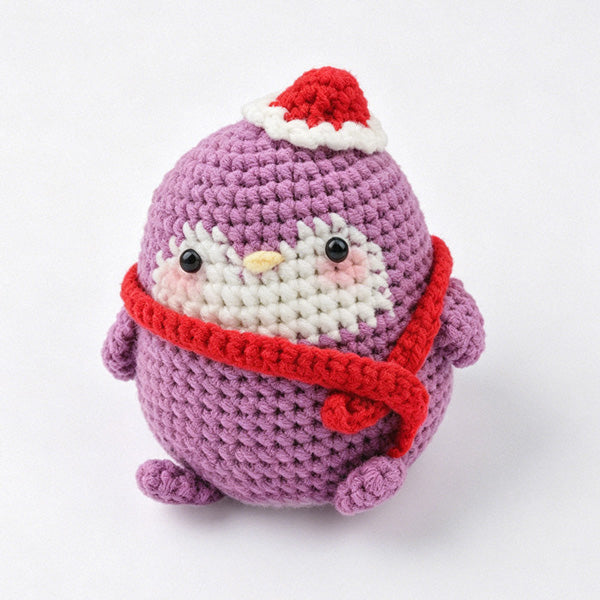 Handcrafted penguin keychain, soft cotton yarn close-up | Knoblom