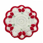 Handcrafted tulip coaster in chunky cotton yarn, close-up | Knoblom