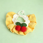 Handmade crochet cherry pet bib collar in pink on pink background