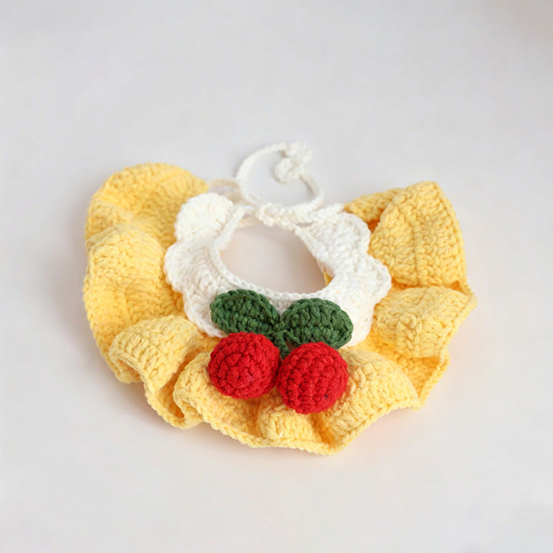 Handmade crochet cherry pet bib collar in pink — product flat lay