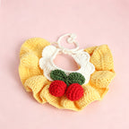 Handmade crochet cherry pet bib collar in yellow — close-up detail
