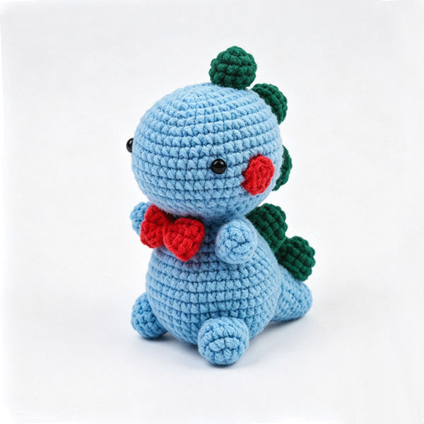 Handmade crochet dino doll close-up, soft yarn detail | Knoblom
