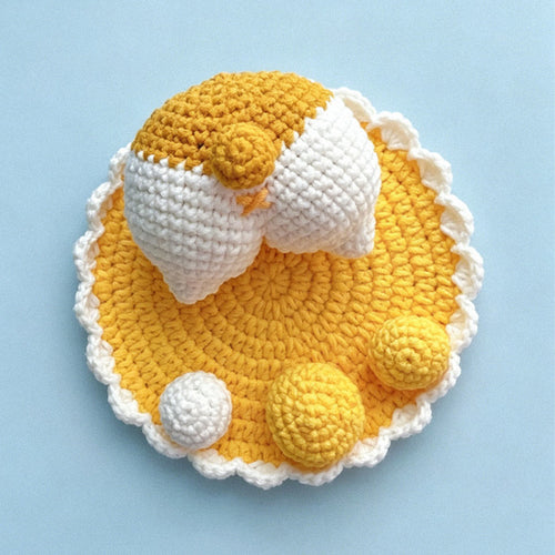 Handmade crochet duck phone stand in mustard yellow and cream | Knoblom