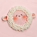 Handmade crochet lamb face coaster with fluffy white border | Knoblom