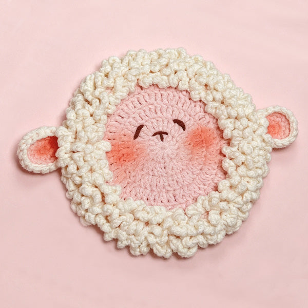 Handmade crochet lamb face coaster with fluffy white border | Knoblom