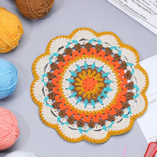 Handmade crochet macaron pastel coaster in mint blue, pink, yellow and white