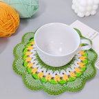 Handmade crochet mandala coasters in blue, green and pink colorways flat lay