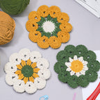 Handmade crochet meadow green daisy coaster in deep green and yellow