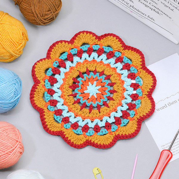 Handmade crochet ocean blue mandala coaster in deep blue, golden yellow and white