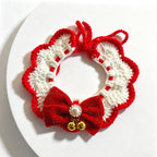 Handmade crochet orange and cream lace ruffle pet collar with bow and pom-pom, flat lay | Knoblom