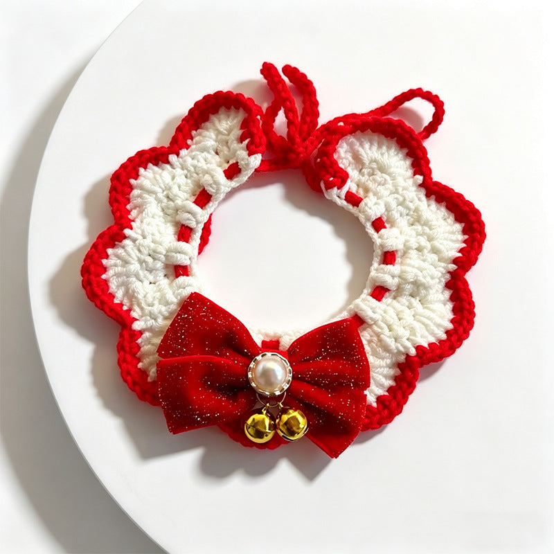 Handmade crochet pink and yellow lace ruffle pet collar with bow and pom-pom, flat lay | Knoblom