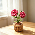 Handmade crochet rose flower pot decor in natural light on wooden table
