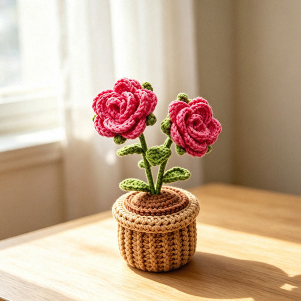 Handmade crochet rose flower pot decor in natural light on wooden table