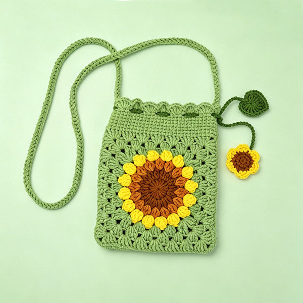 Handmade crochet sunflower crossbody bag in golden yellow and sage green | Knoblom