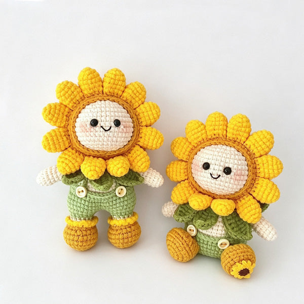 Handmade crochet sunflower dolls placed on a wooden serving tray