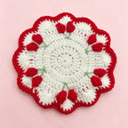 Handmade crochet tulip coaster with red tulip buds on cream base | Knoblom